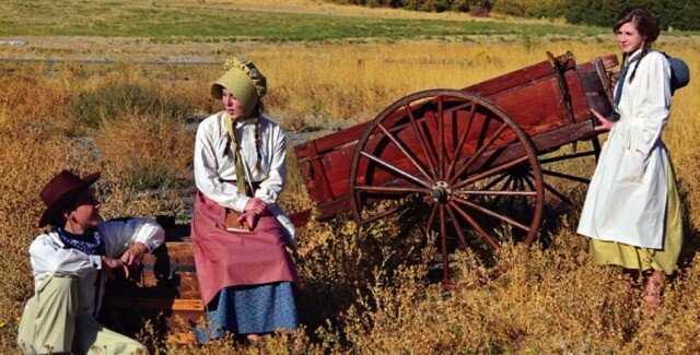 A trek family together at their handcart